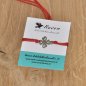 Preview: Armband aus gewachster Baumwolle in rot mit Charm "vierblättriges Kleeblatt" aus Edelstahl 304 und Schiebeverschluss mit Perle aus Edelstahl 304